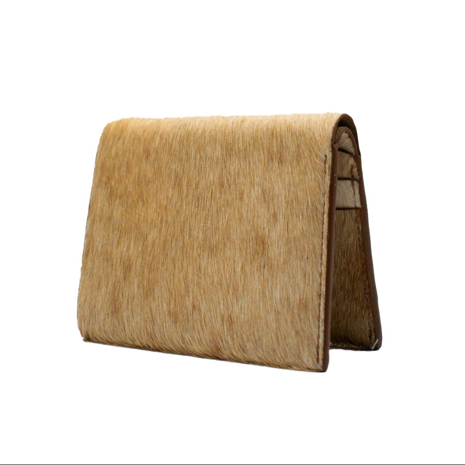 Beige Hair On Wallet on a white background