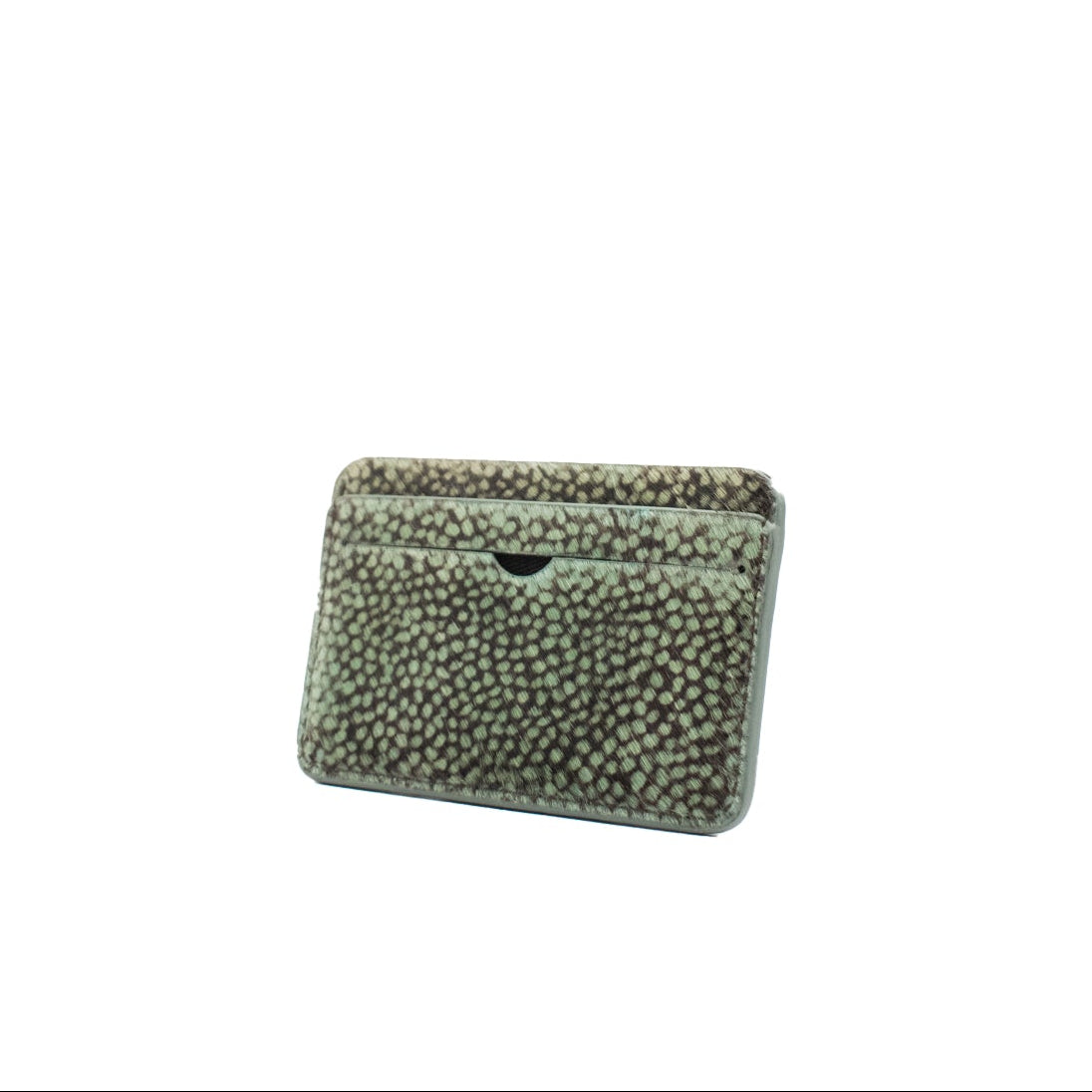 compact dot print cowhair cardholder with a textured surface on a white background