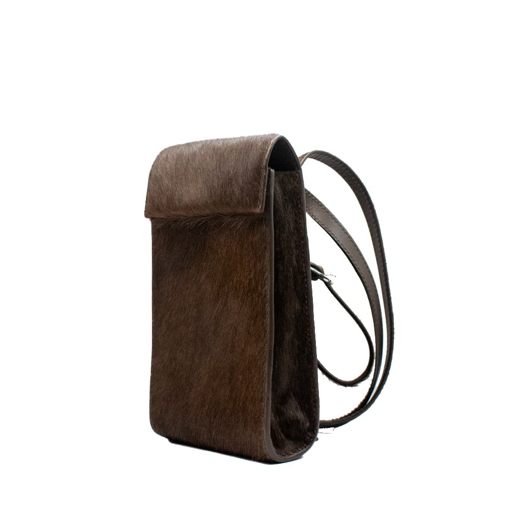 Brown leather phone bag on a white background