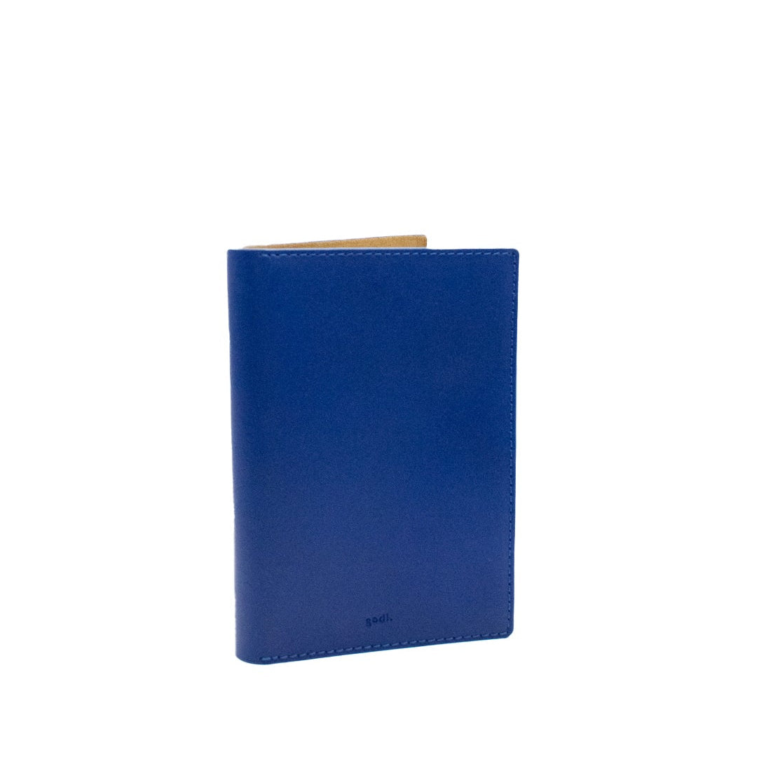 Blue leather passport cover on a white background