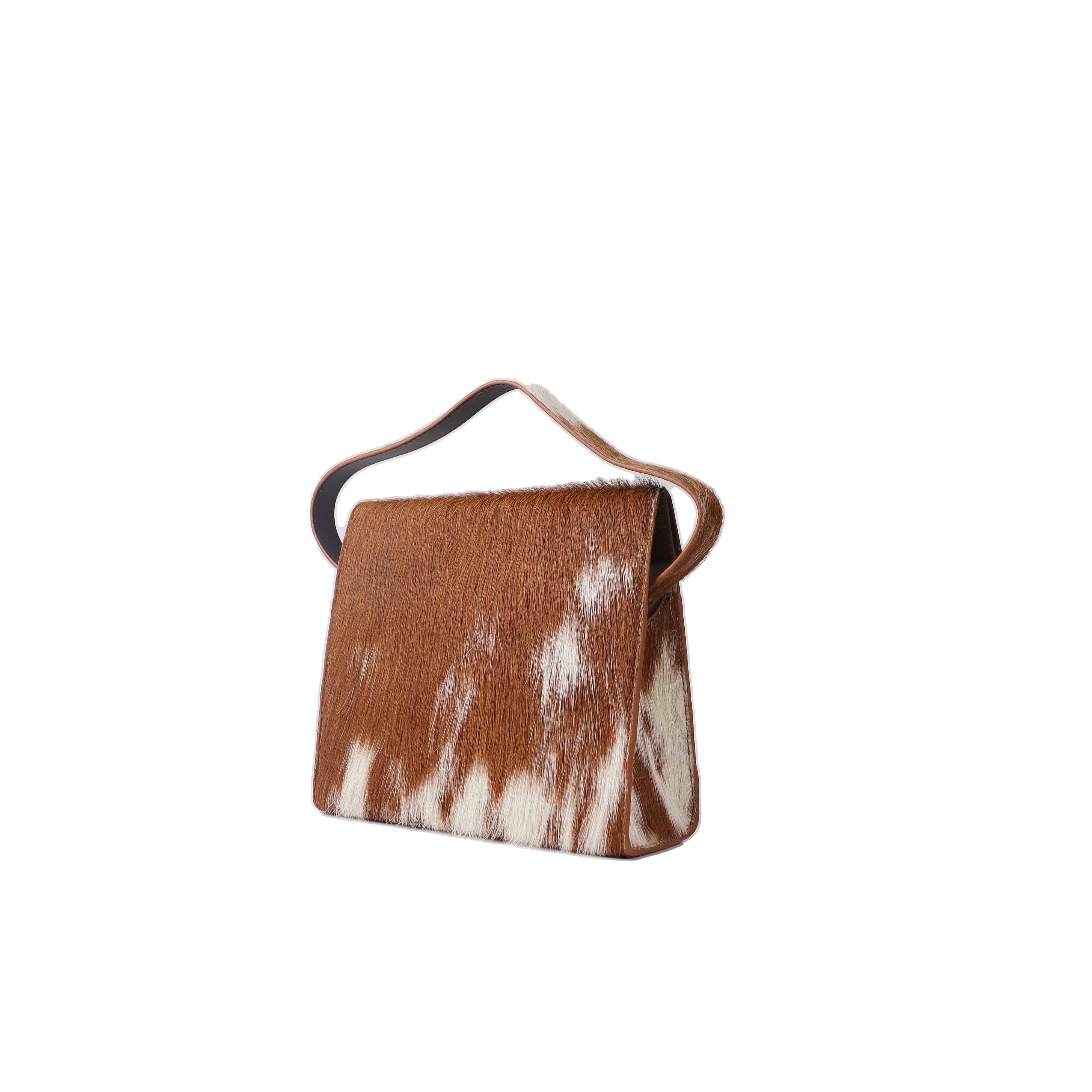 Brown and white cowhide handbag on a white background